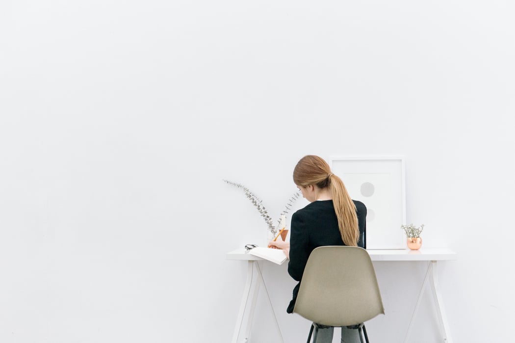 Woman Working in a Minimalist Office Space